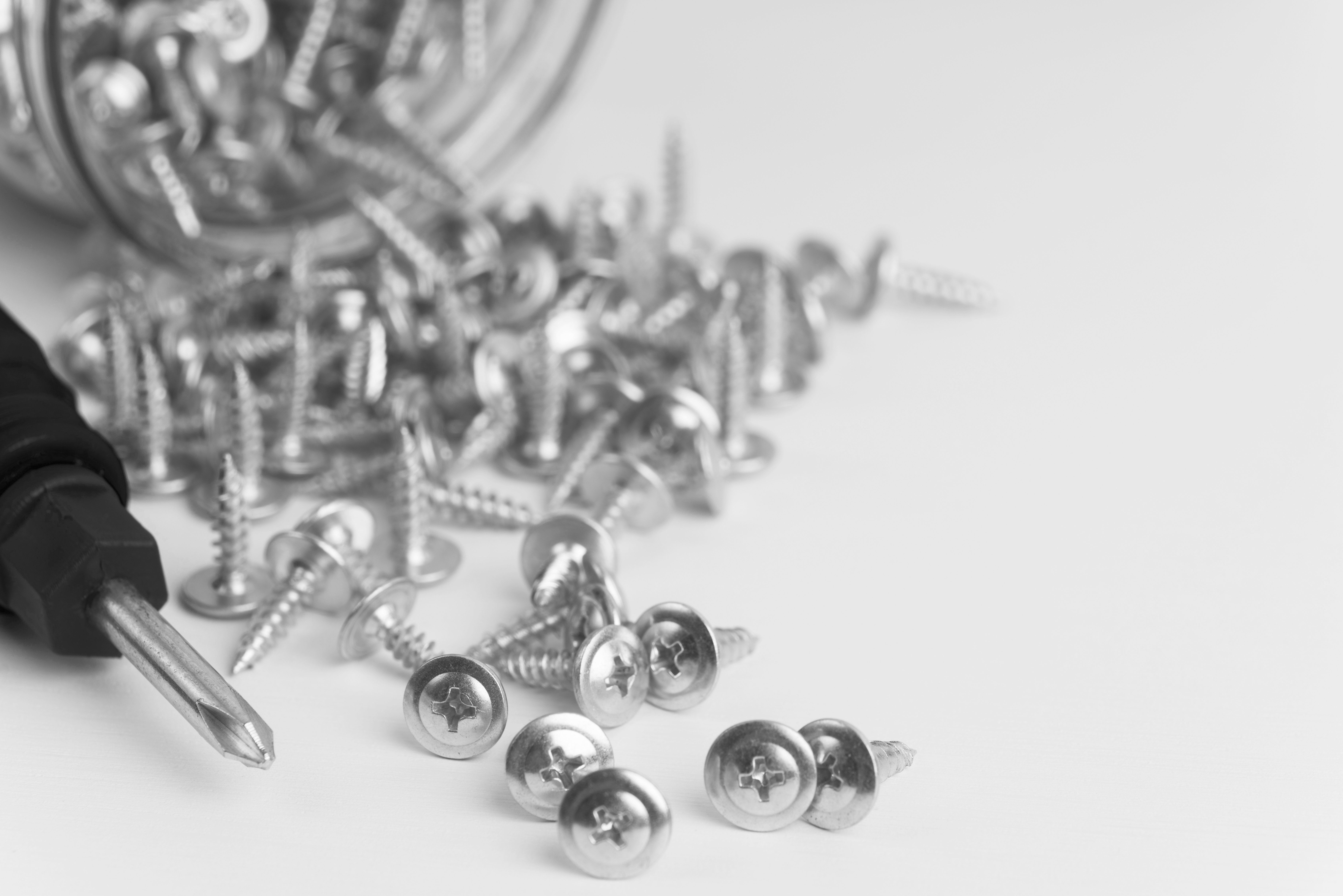 close-up-screws-white-table